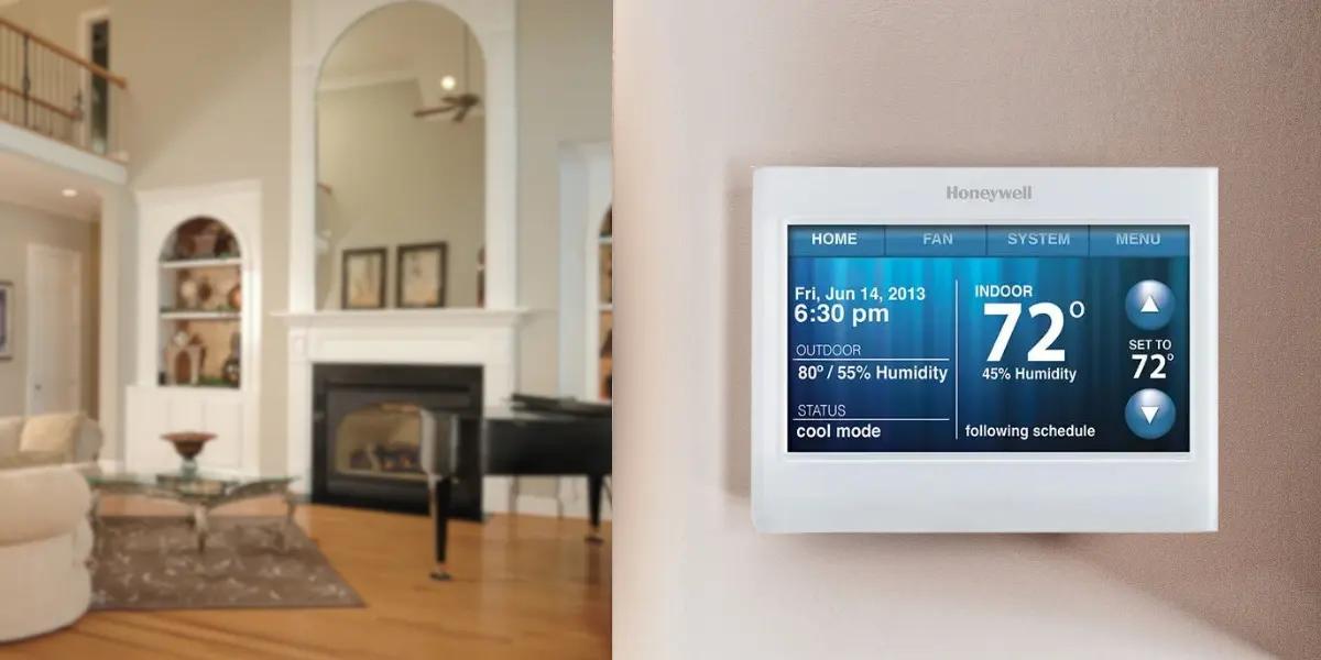 Honeywell Wi-Fi 9000 Color Touchscreen Thermostat installed in a modern living room, provided by SS&B Heating & Cooling. The display shows indoor temperature, humidity, and mode settings