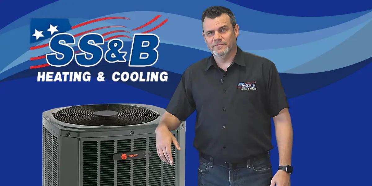 SS&B Heating & Cooling spokesperson Tom with a Trane air conditioner, promoting reliable cooling solutions.