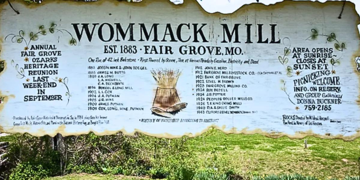 Sign of Wommack Mill in Fair Grove, Missouri: A historic marker with detailed information about Wommack Mill, showcasing its significance in Fair Grove's history.