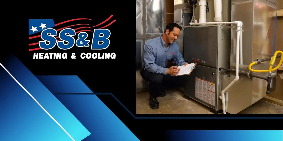 SS&B Heating & Cooling technician inspecting a condensing furnace, ensuring optimal performance. SS&B Heating & Cooling logo is displayed, representing reliable HVAC services in Springfield, MO.