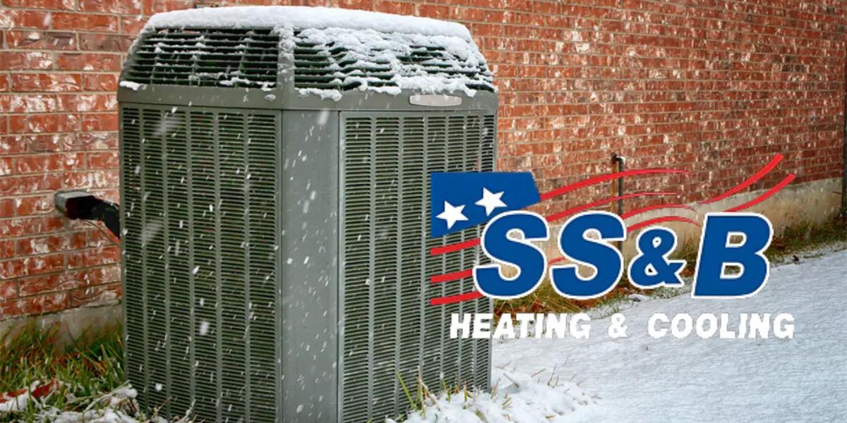 Trane heat pump operating in winter, showcasing its durable design and efficiency in cold weather conditions.