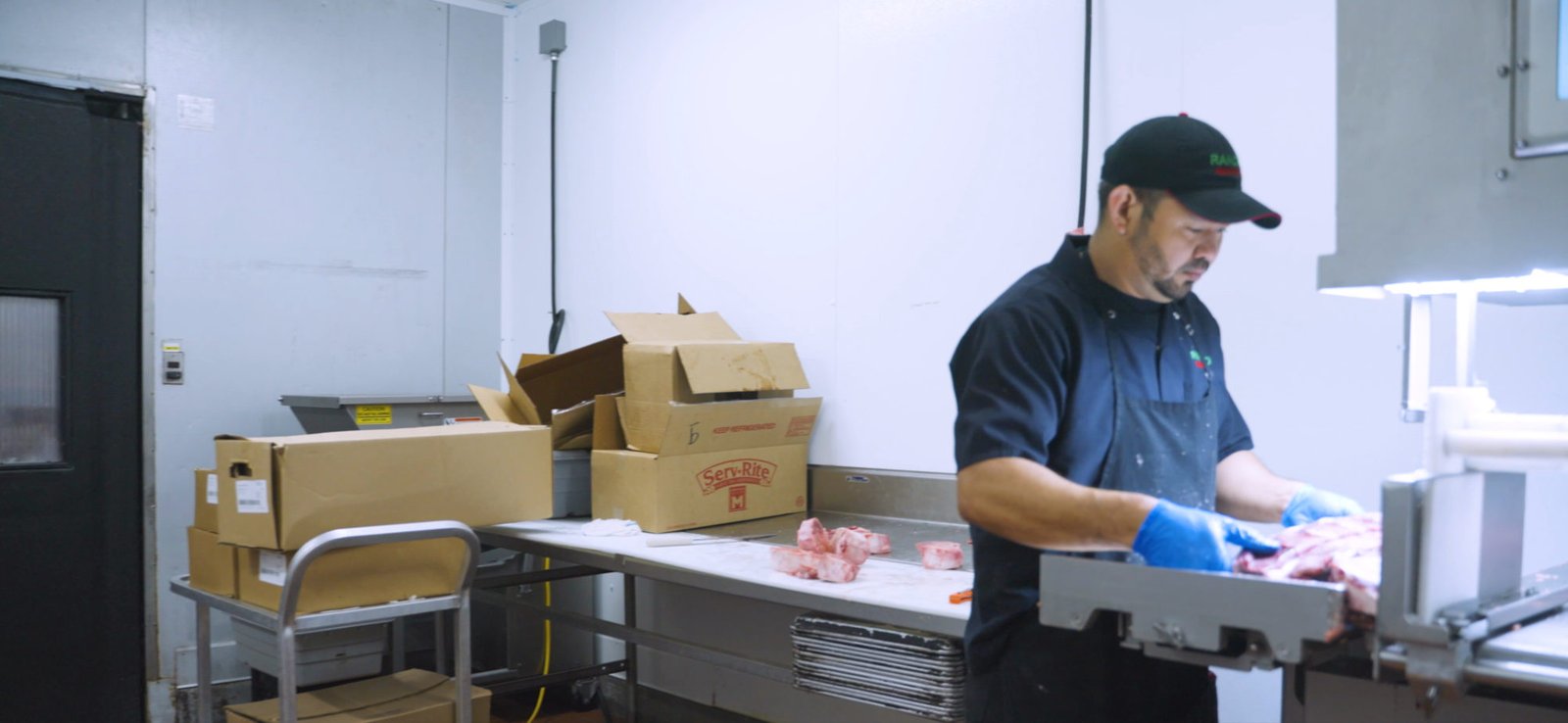 Operator cutting on a Guardian Lite in a Rancho Markets back room