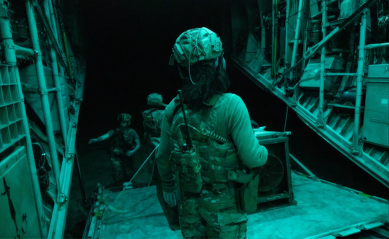 Soldiers loading equipment under low light