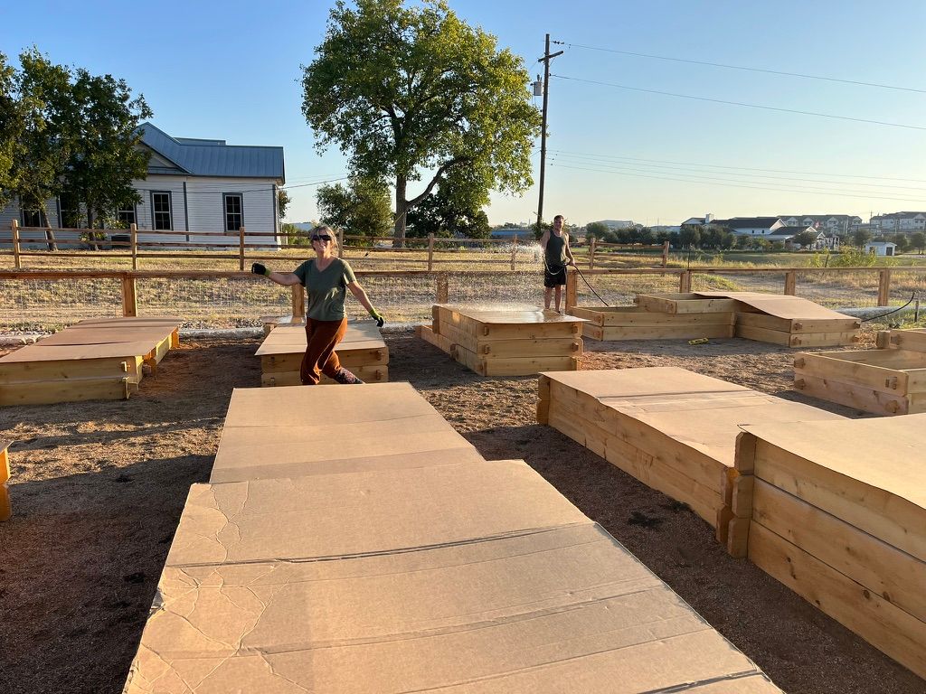 Bergstrom Community Gardens overview, cardboard bed prep