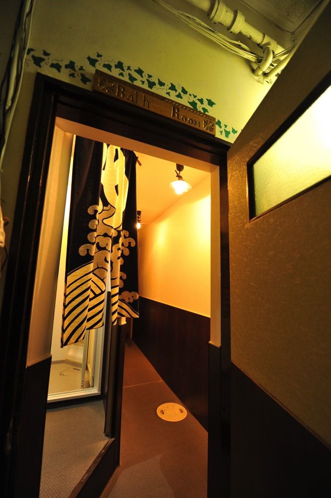 Behind the noren curtain, you'll find the shower.