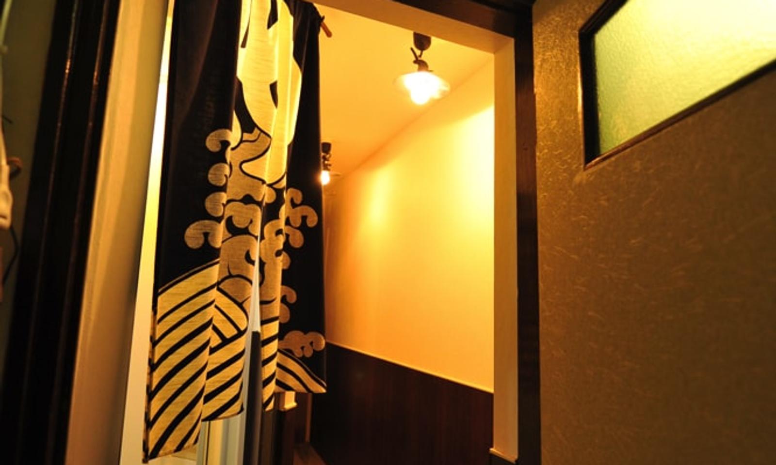 Behind the noren curtain, you'll find the shower.