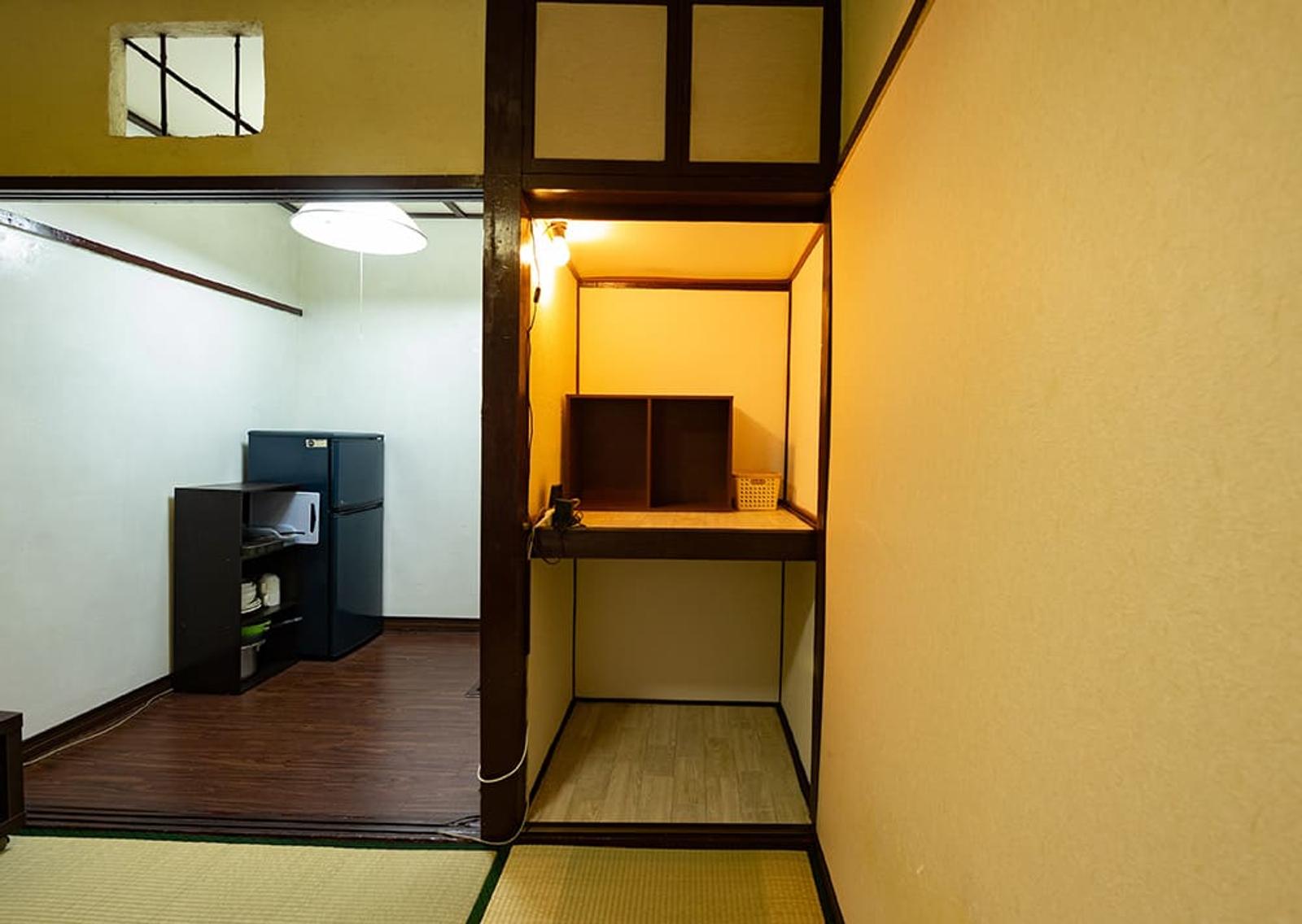 The closet can double as a desk with a lamp, bookshelf, and multiple wall outlets.