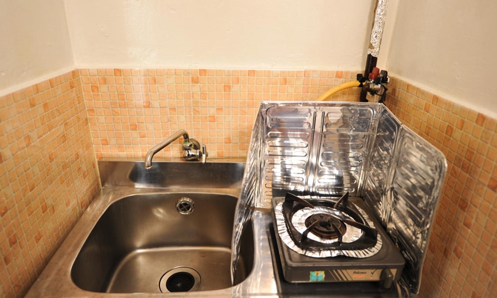 Each room has both water and gas. There is also a gas cooker.