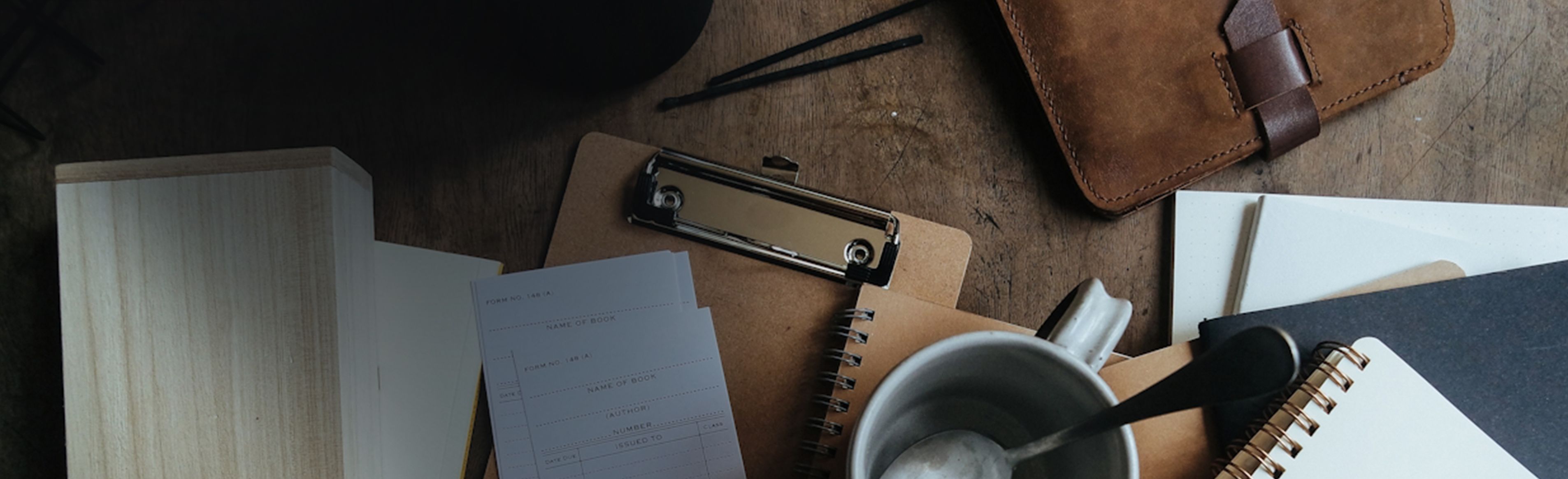 Workplace desk with coffee cup and business items