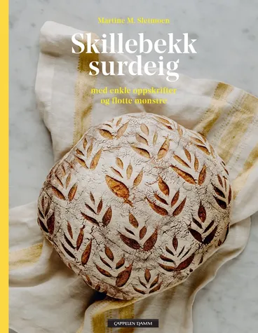 Omslag Skillebekk surdeig med enkle oppskrifter og flotte mønstre av Martine Sletmoen (Innbundet)