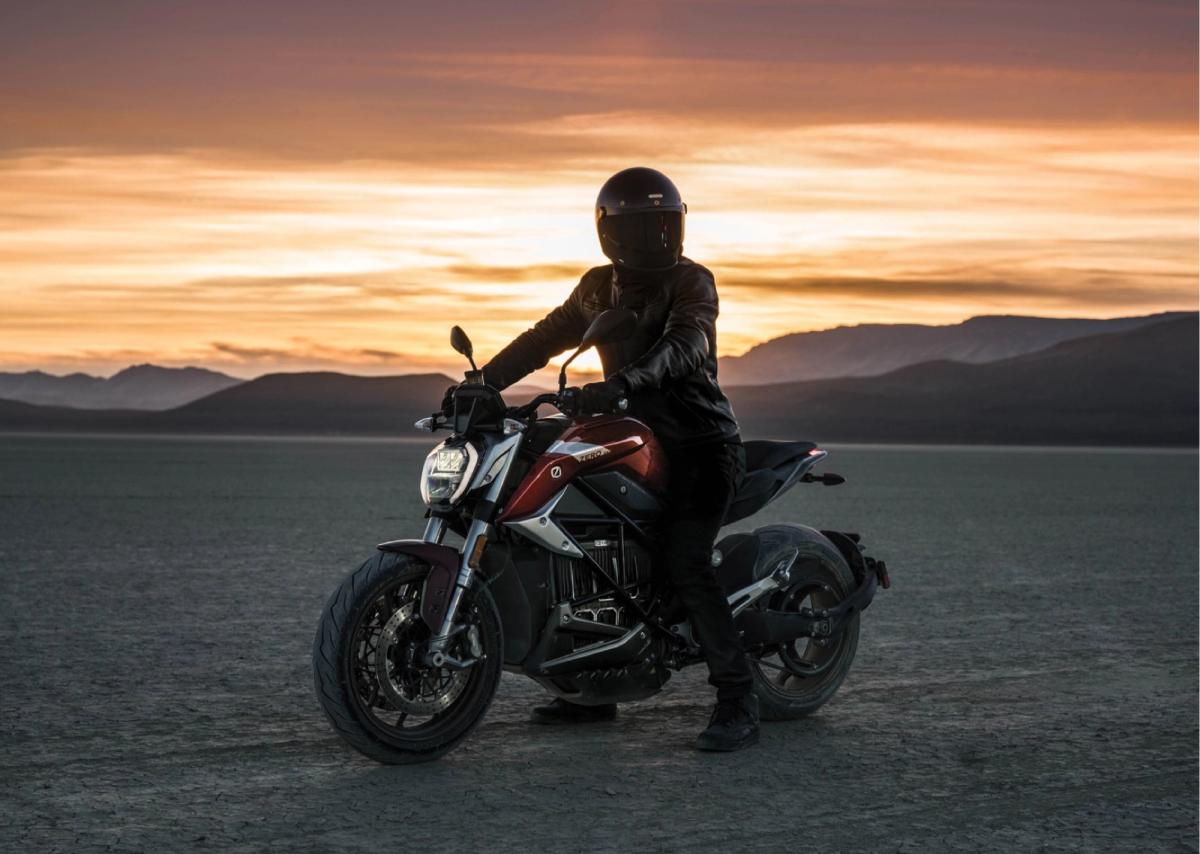 Zero SR/F rider silhouetted against a desert sunset