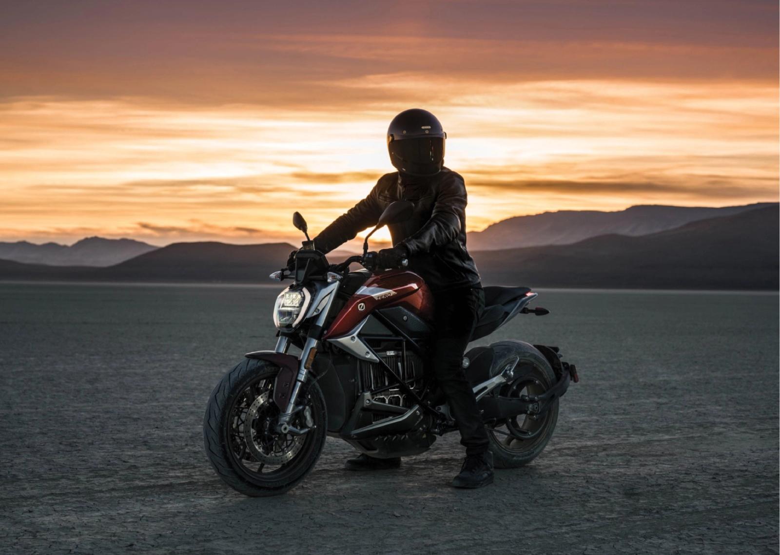 Zero SR/F rider silhouetted against a desert sunset