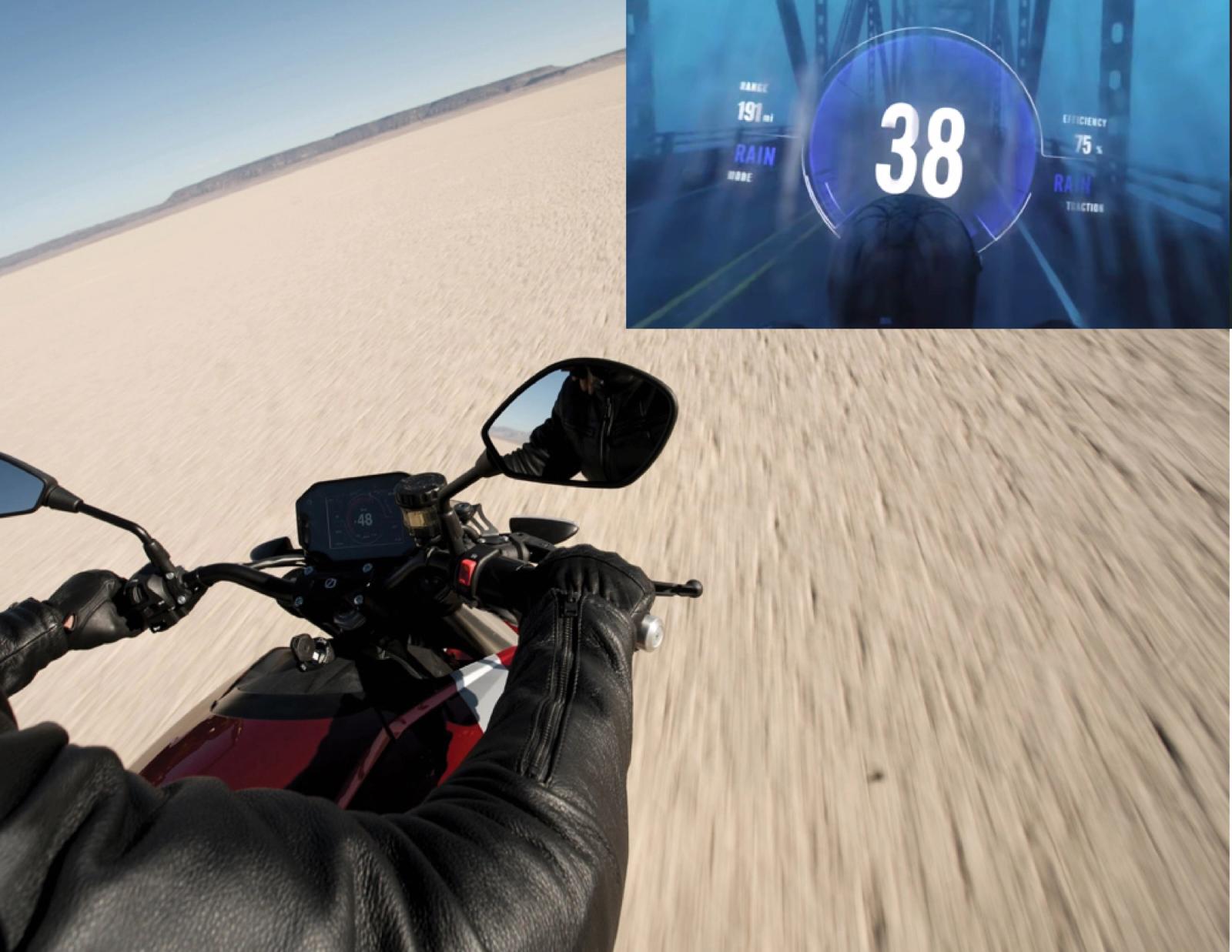 Point-of-view shot riding the Zero SR/F across a dry lakebed, dashboard HUD inset