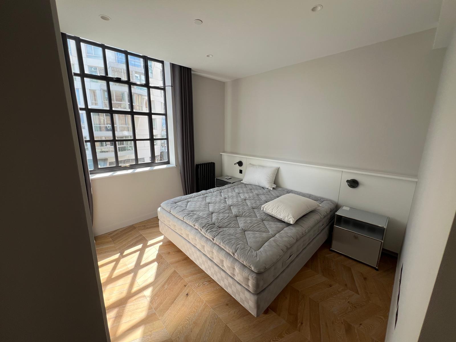 Refurbished bedroom with fitted wardrobe, Battersea Power Station