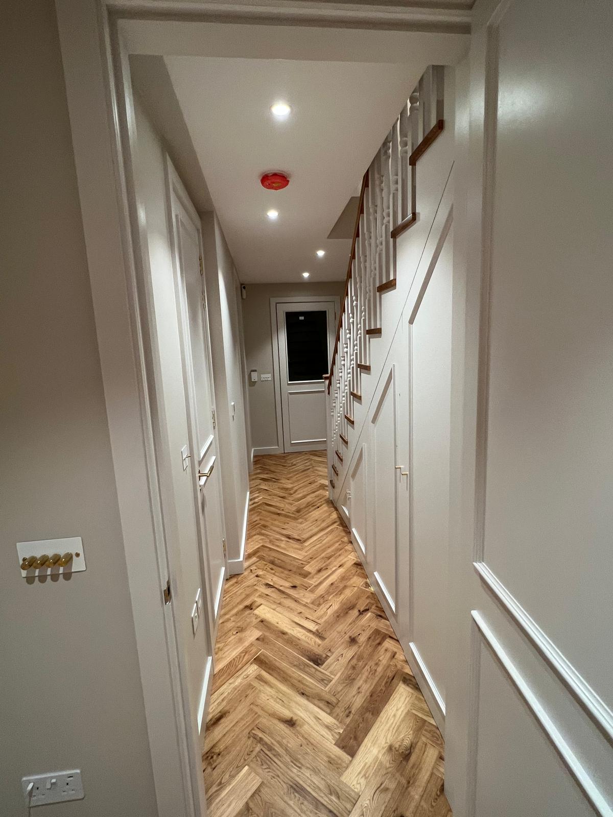 Bespoke under-stairs cupboard with fitted doors