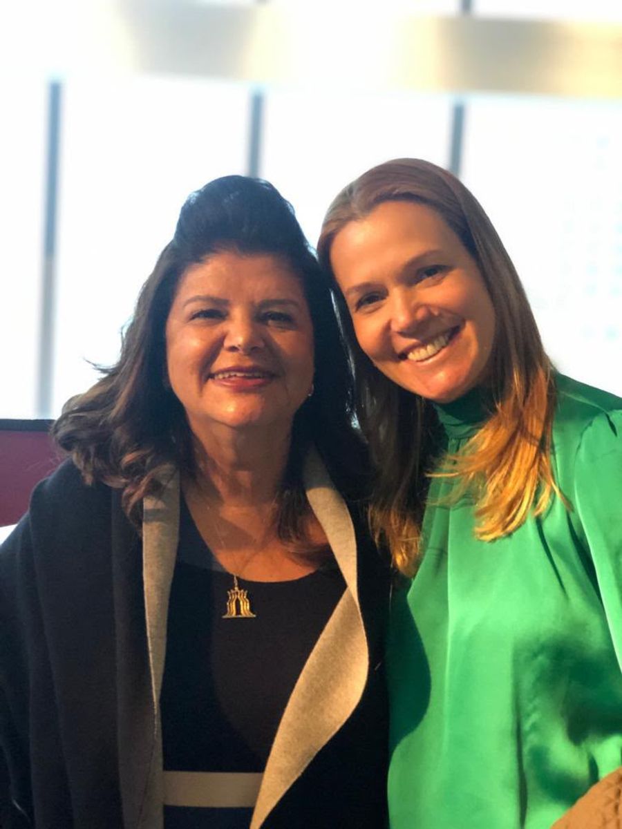 Andrea Eboli com uma liderança empresarial em um encontro