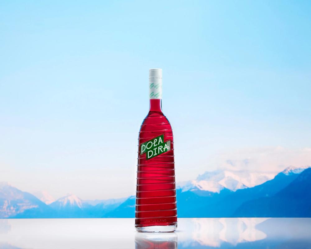 Doladira bottle with Alps in the background