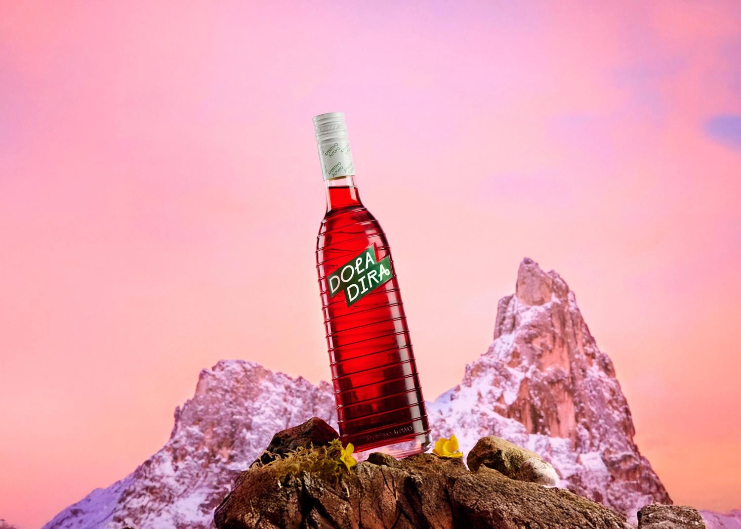 Doladira bottle with Alps in the background