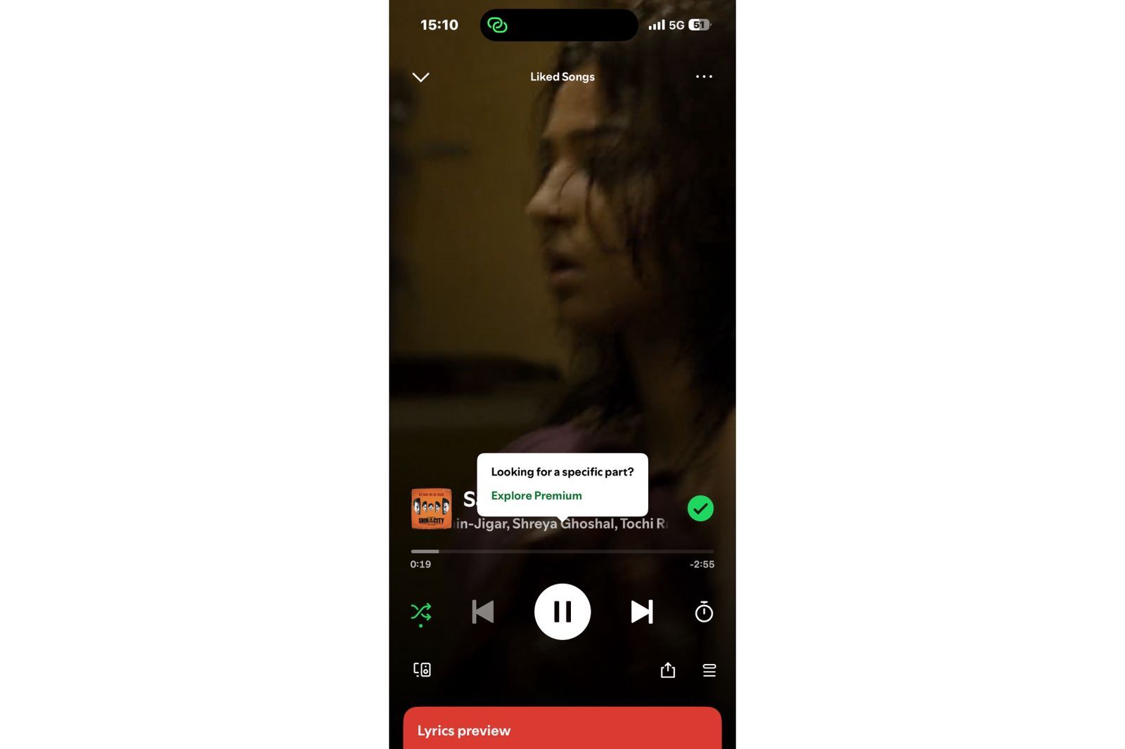 Spotify displays a Premium upgrade prompt when a free user attempts to navigate to a specific part of a song, highlighting a restricted playback control.