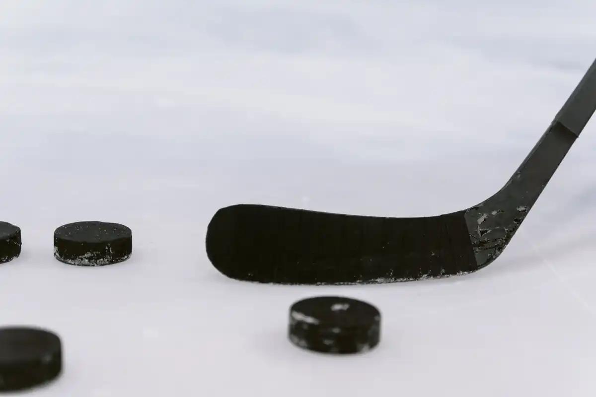 Illustrative close-up of a hockey stick and puck