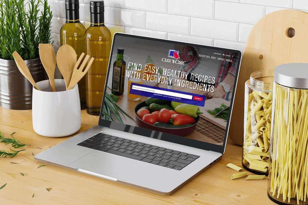 Click ‘N Cook site on a kitchen counter laptop