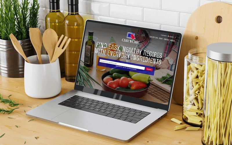 Click ‘N Cook site on a kitchen counter laptop