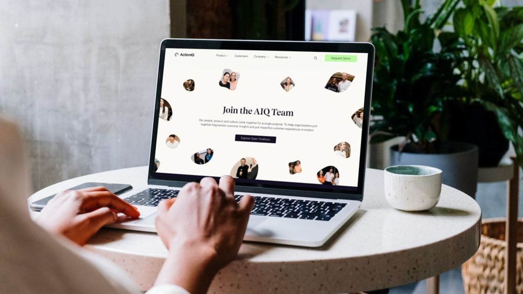 ActionIQ website on a laptop