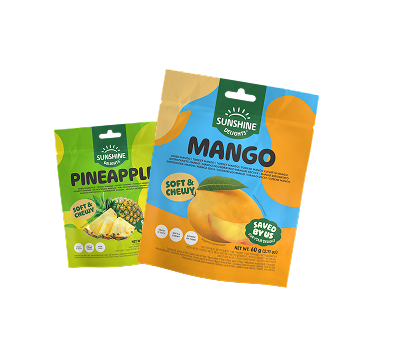 Two pouches of Sunshine Delights soft & chewy dried fruit, one pineapple and one mango.