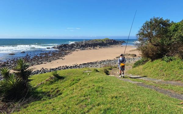 Young boy with fishing rod at a beach on the Transkei coast