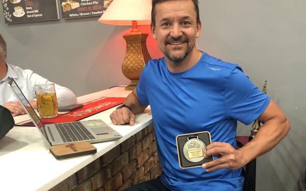 Donavan Roscoe proudly shows off his medal after finishing 4Islands Epic in Croatia