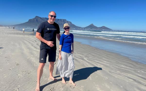 Steve Collins with his daughter. Table Mountain in the background