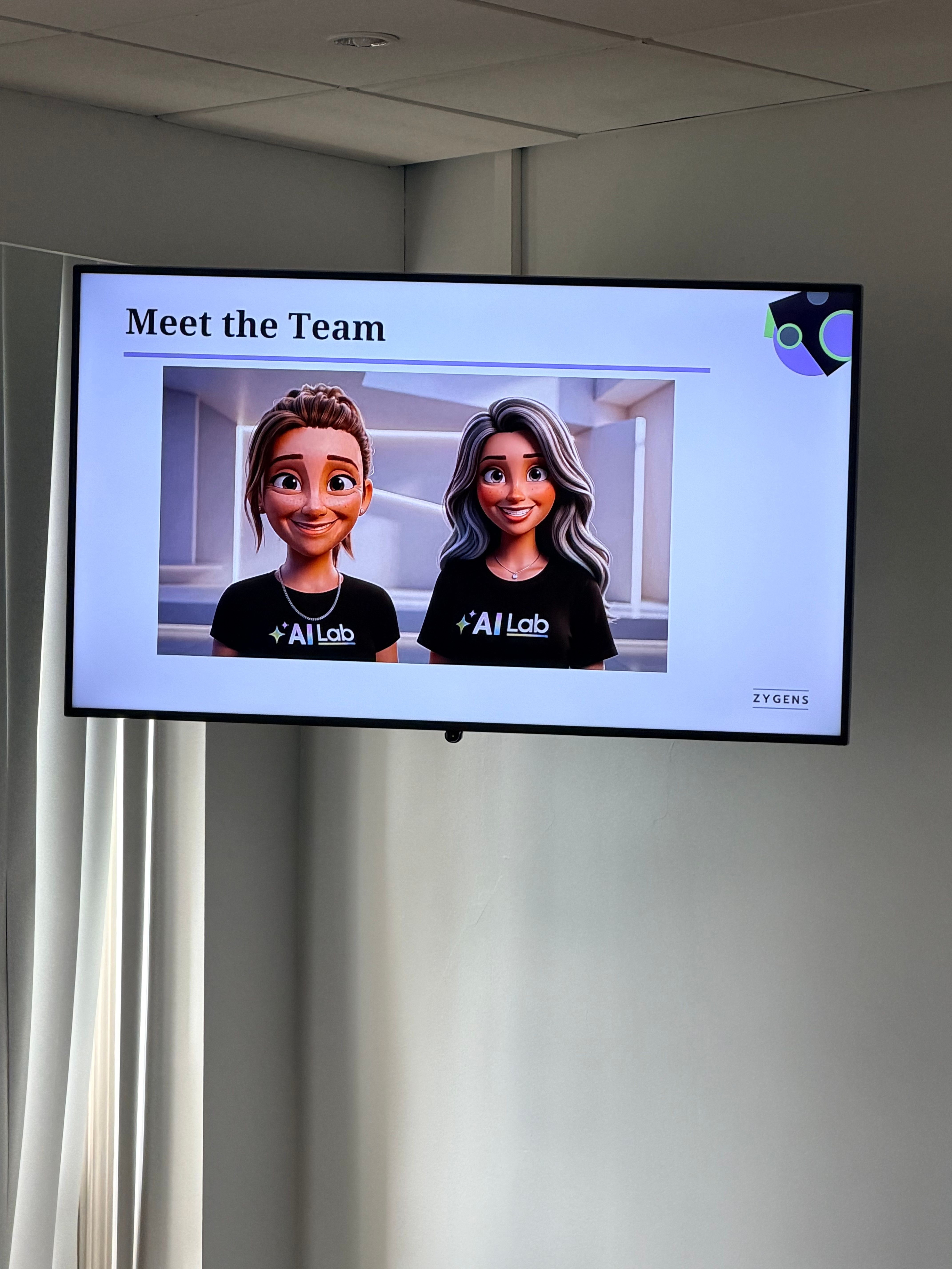 AI Lab Meet the Team slide on screen showing the Zygens team avatars wearing AI Lab t-shirts, Leeds University Business School, 12 June 2026