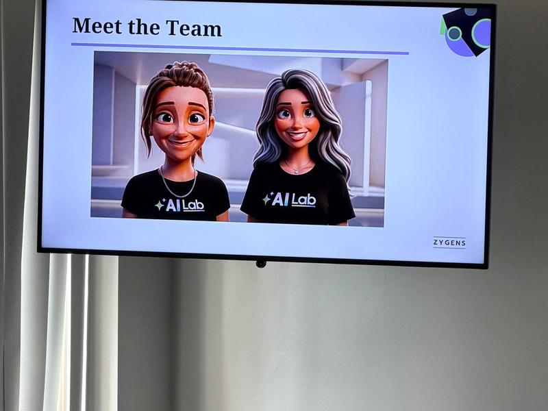 AI Lab Meet the Team slide on screen showing the Zygens team avatars wearing AI Lab t-shirts, Leeds University Business School, 12 June 2026
