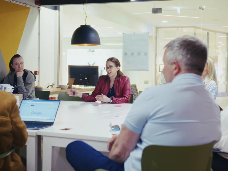 Professionals working at a shared table