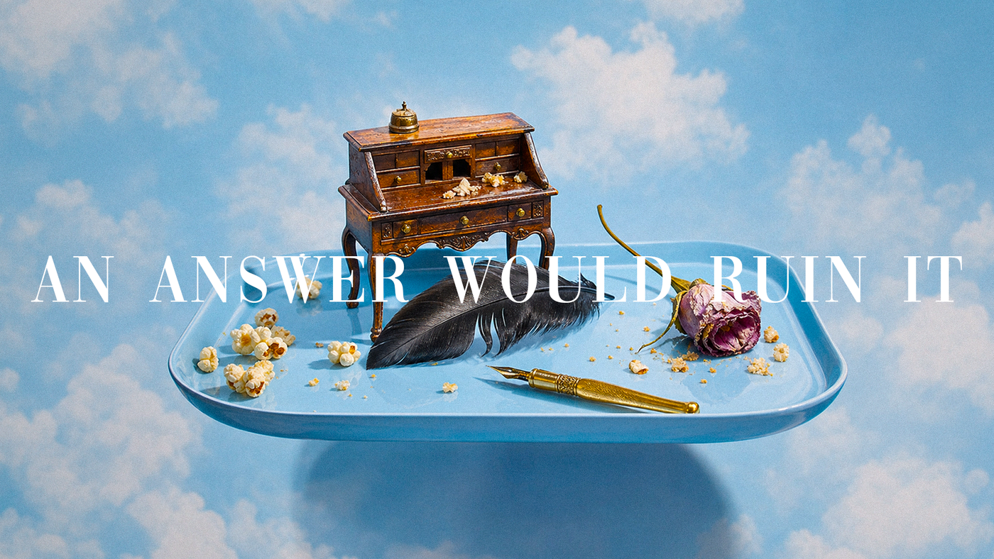 Surreal editorial still life for nufero's "Raven and Writing Desk" blog post: a miniature antique wooden writing desk, a black raven feather, a wilted rose, a brass quill pen, and scattered popcorn arranged on a floating light-blue tray against a dreamy cloud-filled sky background, overlaid with the text "An answer would ruin it."