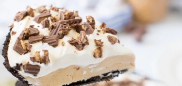 closeup of a slice of pie sprinkled with chocolate pieces.