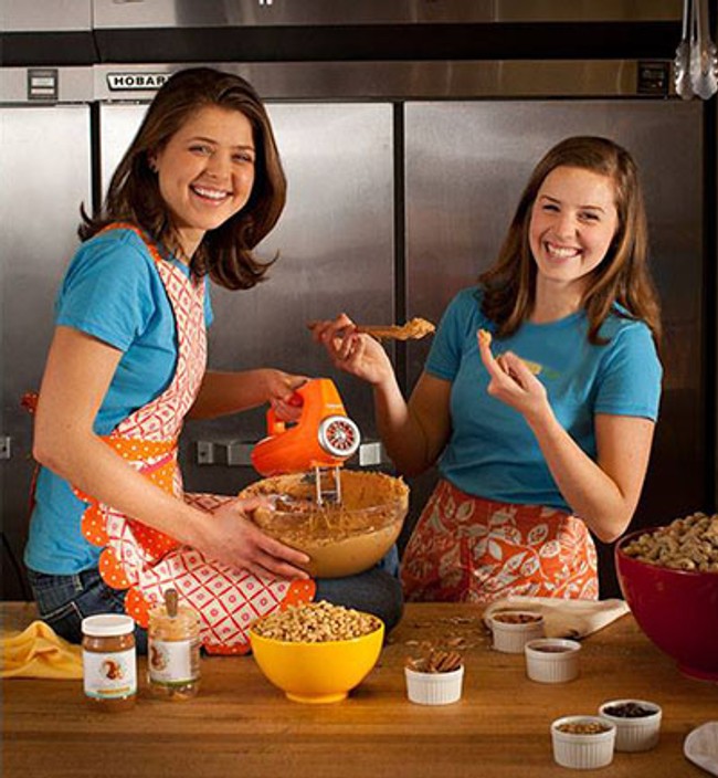 two women with aprons making peanut butter recipes