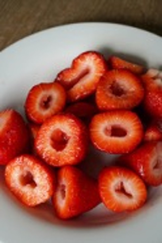 bowl full of strawberries cut in half