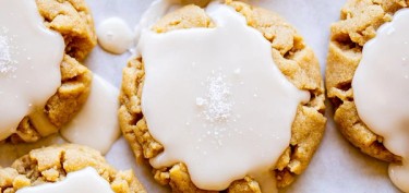 a soft cookie glazed with white cream.
