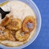 A creamy Jamaican porridge topped with golden caramelized banana slices