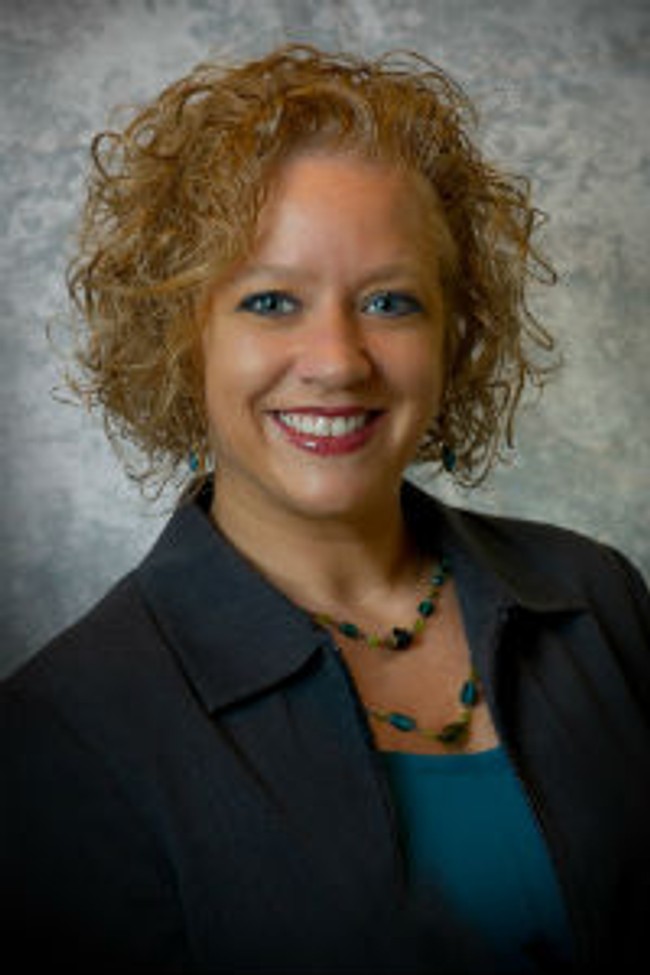 A photo of Eleanor Garrow-Holding wearing formal clothes.