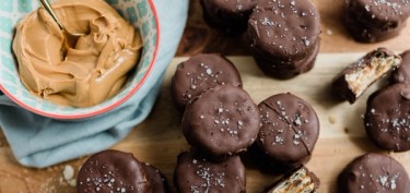 alfajores cookies covered in chocolate and filled with peanut butter.