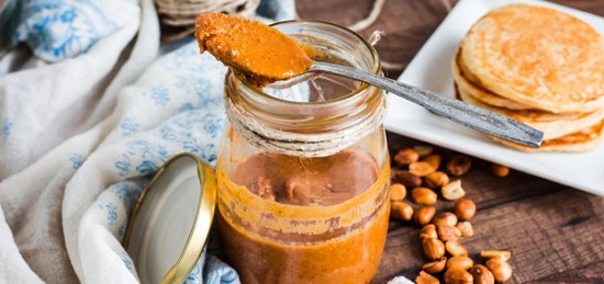 a jar filled with homemade peanut butter.