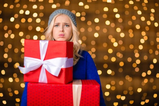 stressed out woman holding gifts