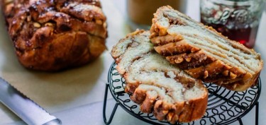 two slices of sweet bread on top of a cooling rack.