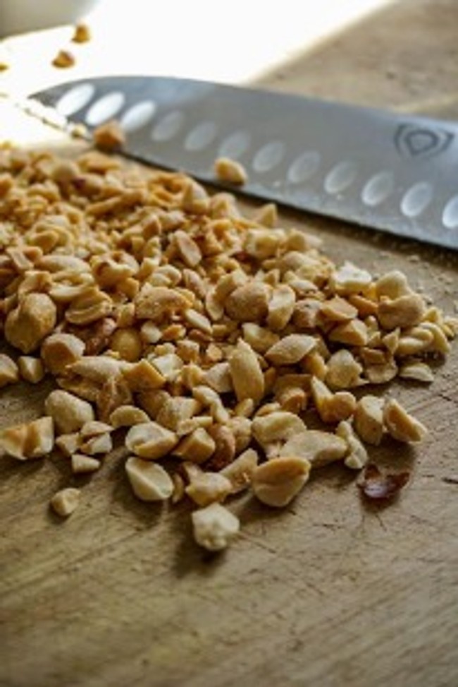 diced peanuts on a cutting board