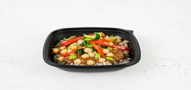 a plastic container full of chickpeas, sliced vegetables and rice.