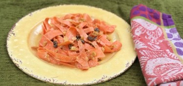 thin slices of carrots with raisins and peanut chunks.