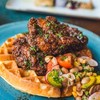 chickens and waffles on a plate