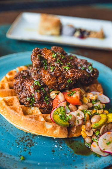 chickens and waffles on a plate